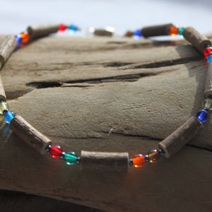 This neckalce contains Hazelwood and Glass Beads in multi colour 